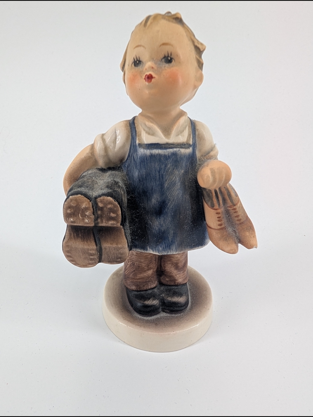 Goebel Hummel figurine titled "Boots" (model #143/0)